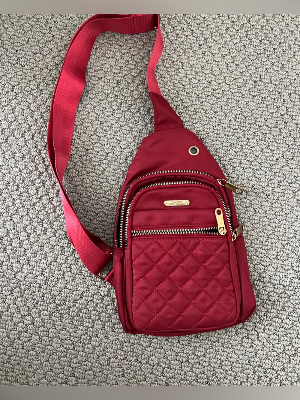 Quilted 3-Pocket Red Crossbody Sling Bag with Adjustable Strap and Gold Accents